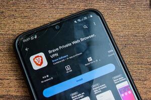 Brave Private Web Browser, VPN application on Smartphone screen. Brave is a freeware web browser developed by Brave software. Bekasi, Indonesia, February 21, 2024 photo