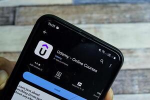 Udemy - Online Courses application on Smartphone screen. Udemy is a freeware web browser developed by Udemy. Bekasi, Indonesia, February 15, 2024 photo
