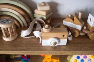 A shelf with children's wooden toys in the children's room. Children's concept photo