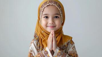 AI generated Cute muslim little asian girl greeting  with hand isolated on white background.jpg photo