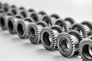 AI generated Black and white close up of a series of aligned metal gears showcasing concepts of teamwork, machinery, and precision engineering, with a depth of field effect photo