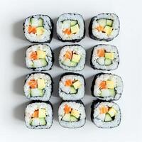 AI generated Top view of assorted sushi rolls neatly arranged on a white surface, ideal for culinary themes and Japanese cuisine related content photo