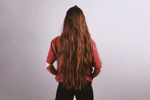 brunette woman with very long hair down to her butt photo