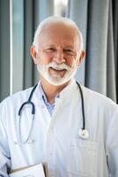 Portrait of senior mature health care professional, doctor, with stethoscope photo