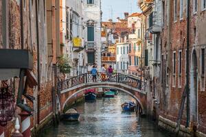 Venetian buildings and boats along Canal Grande, Venice, italy photo