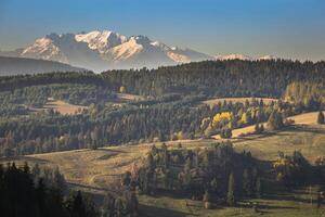 Tatra mountains in rural scene, Poland photo