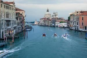 Beautiful view of the Grand Canal and Basilica Santa Maria della Salute in the late evening with very interesting clouds, Venice, Italy photo