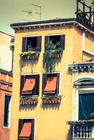 Traditional window of typical old Venice building photo