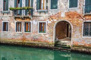 Venetian buildings and boats along Canal Grande, Venice, italy photo