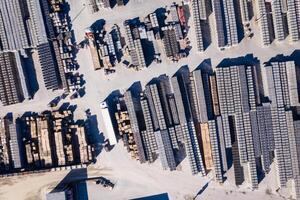 Aerial view of industrial building material,stacked on a construction site photo