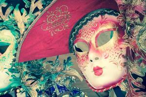 Souvenirs and carnival masks on street trading in Venice, Italy photo