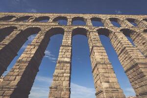 The famous ancient aqueduct in Segovia, Castilla y Leon, Spain photo