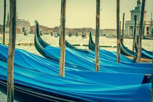 Gondolas moored by Saint Mark square. Venice, Italy, Europe photo