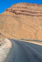 Endless road in Sahara Desert with blue sky,Morocco Africa photo