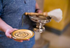 close-up of wedding rings in the church at the wedding ceremony photo