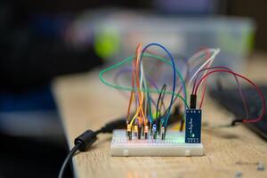 an engineer is engaged in the development and layout of electrical circuits photo