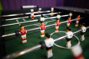 A close-up of the table football game of football figures on the field photo