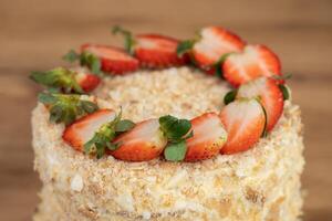 delicious fresh sweet fruit cake decorated with strawberries photo