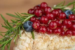 delicious fresh sweet fruit cake decorated with currants and blueberries photo