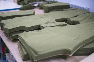 cutting of fabrics cut in production for sewing clothes photo