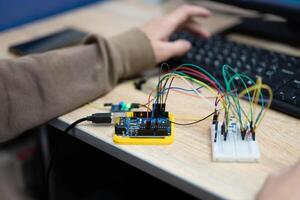 an engineer is engaged in the development and layout of electrical circuits photo