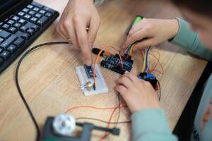 an engineer is engaged in the development and layout of electrical circuits photo