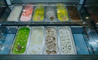 Classic italian food ice cream gelato on display in store. photo
