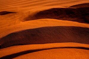 Wadi Rum Desert in Jordan. On the Sunset. Panorama of beautiful sand pattern on the dune. Desert landscape in Jordan. photo