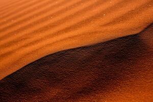 Wadi Rum Desert in Jordan. On the Sunset. Panorama of beautiful sand pattern on the dune. Desert landscape in Jordan. photo