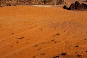 Wadi Rum Desert in Jordan. On the Sunset. Panorama of beautiful sand pattern on the dune. Desert landscape in Jordan. photo