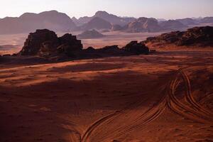 Wadi Rum Desert in Jordan. On the Sunset. Panorama of beautiful sand pattern on the dune. Desert landscape in Jordan. photo