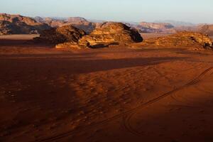 Wadi Rum Desert in Jordan. On the Sunset. Panorama of beautiful sand pattern on the dune. Desert landscape in Jordan. photo