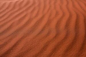 Wadi Rum Desert in Jordan. On the Sunset. Panorama of beautiful sand pattern on the dune. Desert landscape in Jordan. photo