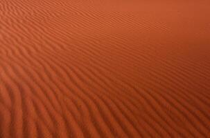Wadi Rum Desert in Jordan. On the Sunset. Panorama of beautiful sand pattern on the dune. Desert landscape in Jordan. photo