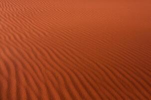 Wadi Rum Desert in Jordan. On the Sunset. Panorama of beautiful sand pattern on the dune. Desert landscape in Jordan. photo