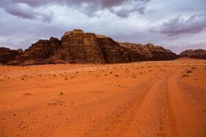 Wadi Rum Desert in Jordan. On the Sunset. Panorama of beautiful sand pattern on the dune. Desert landscape in Jordan. photo