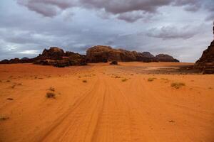 Wadi Rum Desert in Jordan. On the Sunset. Panorama of beautiful sand pattern on the dune. Desert landscape in Jordan. photo