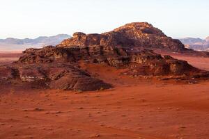 Wadi Rum Desert in Jordan. On the Sunset. Panorama of beautiful sand pattern on the dune. Desert landscape in Jordan. photo