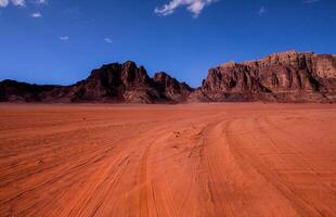 Wadi Rum Desert in Jordan. On the Sunset. Panorama of beautiful sand pattern on the dune. Desert landscape in Jordan. photo