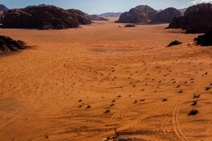 Wadi Rum Desert in Jordan. On the Sunset. Panorama of beautiful sand pattern on the dune. Desert landscape in Jordan. photo