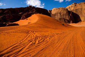 Wadi Rum Desert in Jordan. On the Sunset. Panorama of beautiful sand pattern on the dune. Desert landscape in Jordan. photo