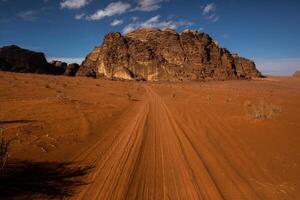 Wadi Rum Desert in Jordan. On the Sunset. Panorama of beautiful sand pattern on the dune. Desert landscape in Jordan. photo