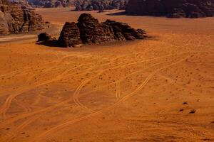 Wadi Rum Desert in Jordan. On the Sunset. Panorama of beautiful sand pattern on the dune. Desert landscape in Jordan. photo