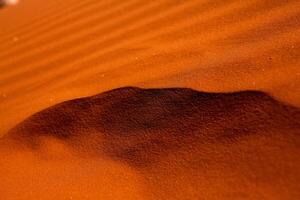 Wadi Rum Desert in Jordan. On the Sunset. Panorama of beautiful sand pattern on the dune. Desert landscape in Jordan. photo