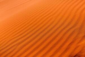 Wadi Rum Desert in Jordan. On the Sunset. Panorama of beautiful sand pattern on the dune. Desert landscape in Jordan. photo