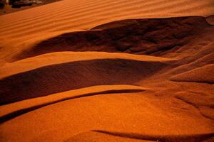 Wadi Rum Desert in Jordan. On the Sunset. Panorama of beautiful sand pattern on the dune. Desert landscape in Jordan. photo