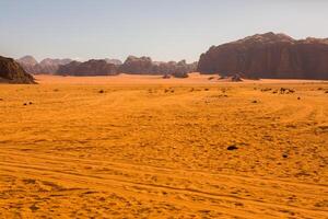 Wadi Rum Desert in Jordan. On the Sunset. Panorama of beautiful sand pattern on the dune. Desert landscape in Jordan. photo