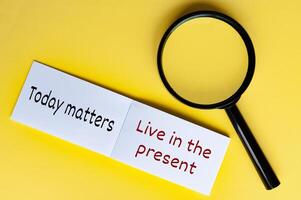 Today matters text on white notepad with magnifying glasses on yellow cover background photo
