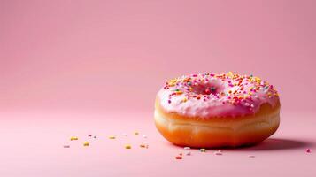 AI generated Sprinkled pink donut over pink background. Delicious frosted sprinkled donut isolated. photo