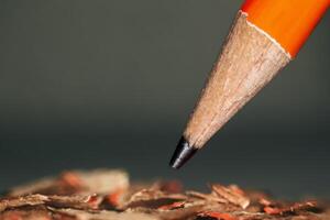 pencil close-up,pencil close-up,sharpened pencil,sharp pencil tip, graphite tip, close-up, wood shavings photo